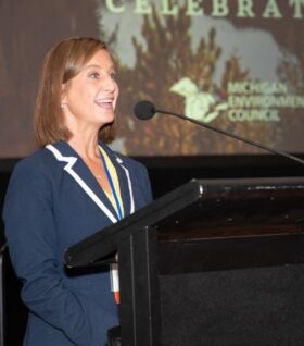 Jennifer McKay speaks before the audience of the 2023 annual event in Dearborn.