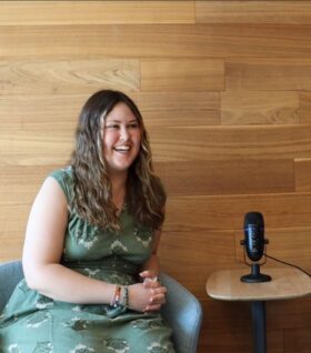 Carlee Knott smiles during a podcast recording.