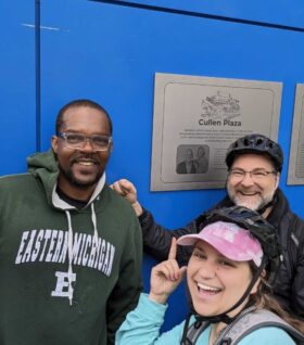 Galen Hardy, Emily Smith, and Conan Smith pose for a photo midway through a Detroit bikeride.