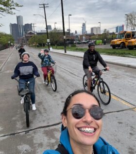 Reese Dillard takes a selfie on a staff bike ride in Detroit.