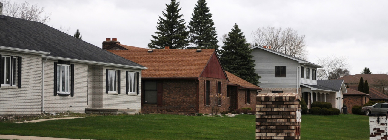 Middle class Michigan houses pictured in a row