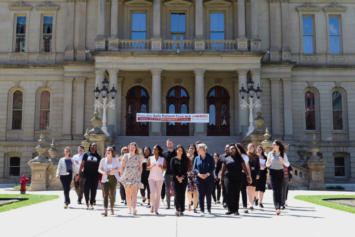 Members of Lead Education Day walk away from the Michigan Capitol in 2024.