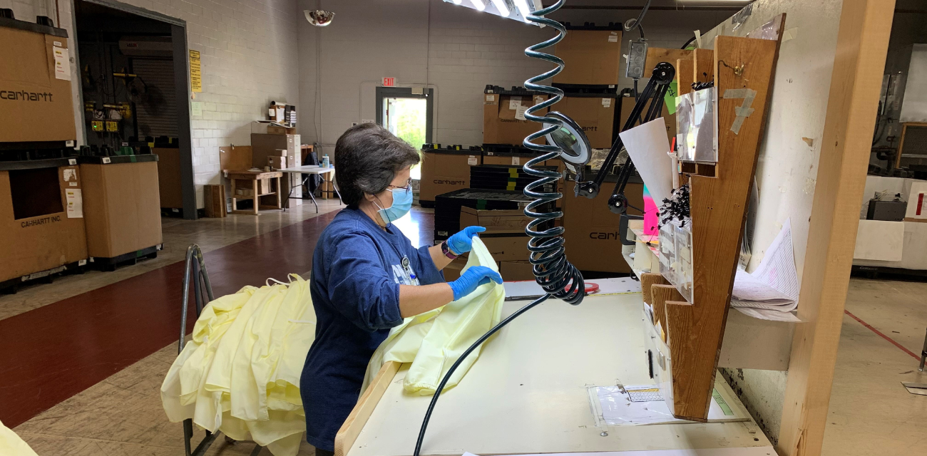 A Carharrt worker creates a medical gown to help healthcare workers during the pandemic