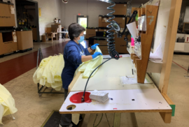 A Carharrt worker creates a medical gown to help healthcare workers during the pandemic