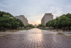 A brick path goes past state government offices and toward the Michigan Supreme Court