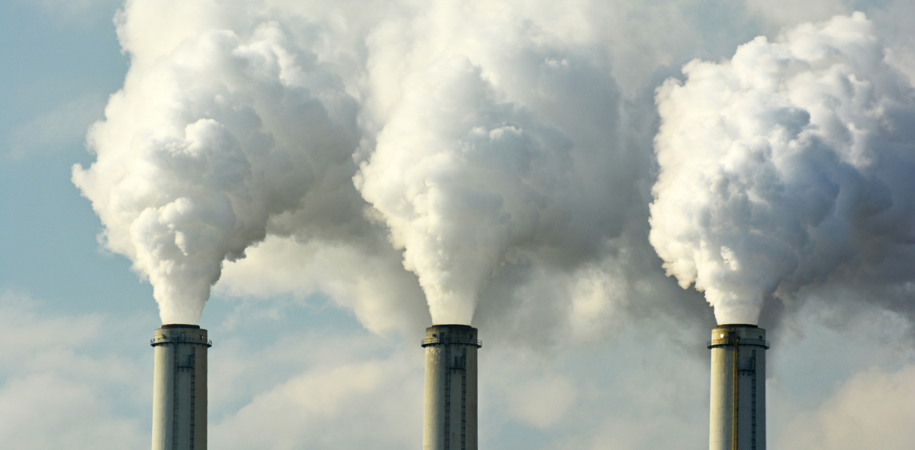 Coal plant smokestacks emit pollution