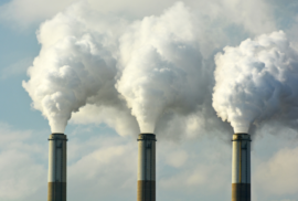 Coal plant smokestacks emit pollution