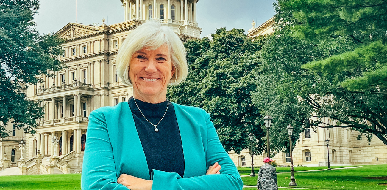 Dr. Joan Rose, water researcher, crosses her arms in the yard of the Michigan Capitol