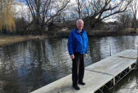 Gary Rayburn poses on a dock along the Pine River. (Photo courtesy of Healthy Pine River).jpg