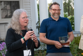 Karen Harrison's speech causes Conan Smith to laugh at the 2021 annual event in Dexter