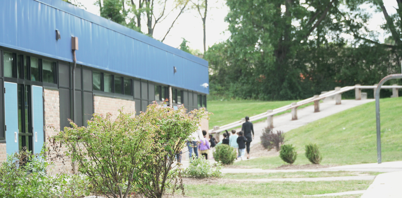 Kids walk away from an Ann Arbor Public School building (Photo courtesy of Midstory)