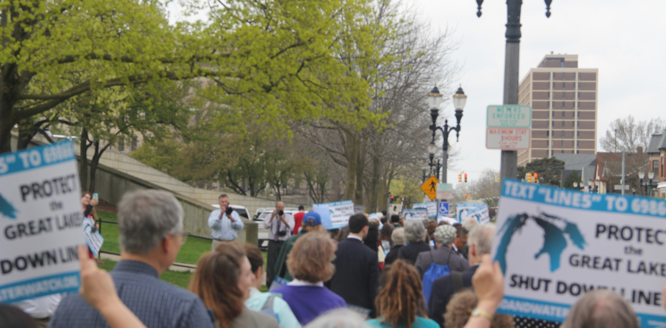 People protest at a 2017 Oil & Water Don't Mix lobby day