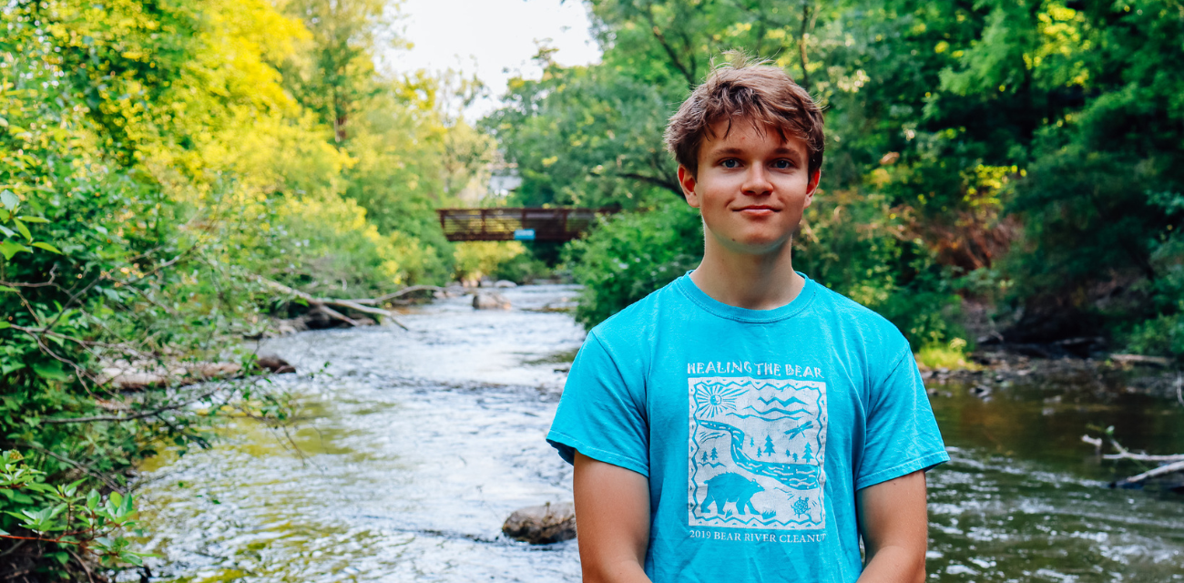 Tommy Skinner poses at a bend in the Bear River in Petoskey