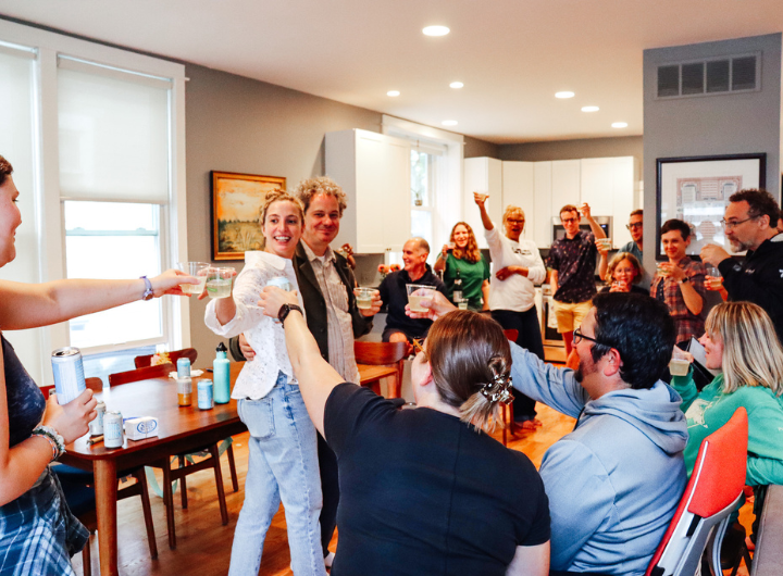 Michigan Environmental Council staff give a toast during a wedding shower in 2023.