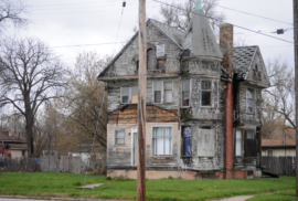 A blighted home remains upright in a Saginaw neighborhood