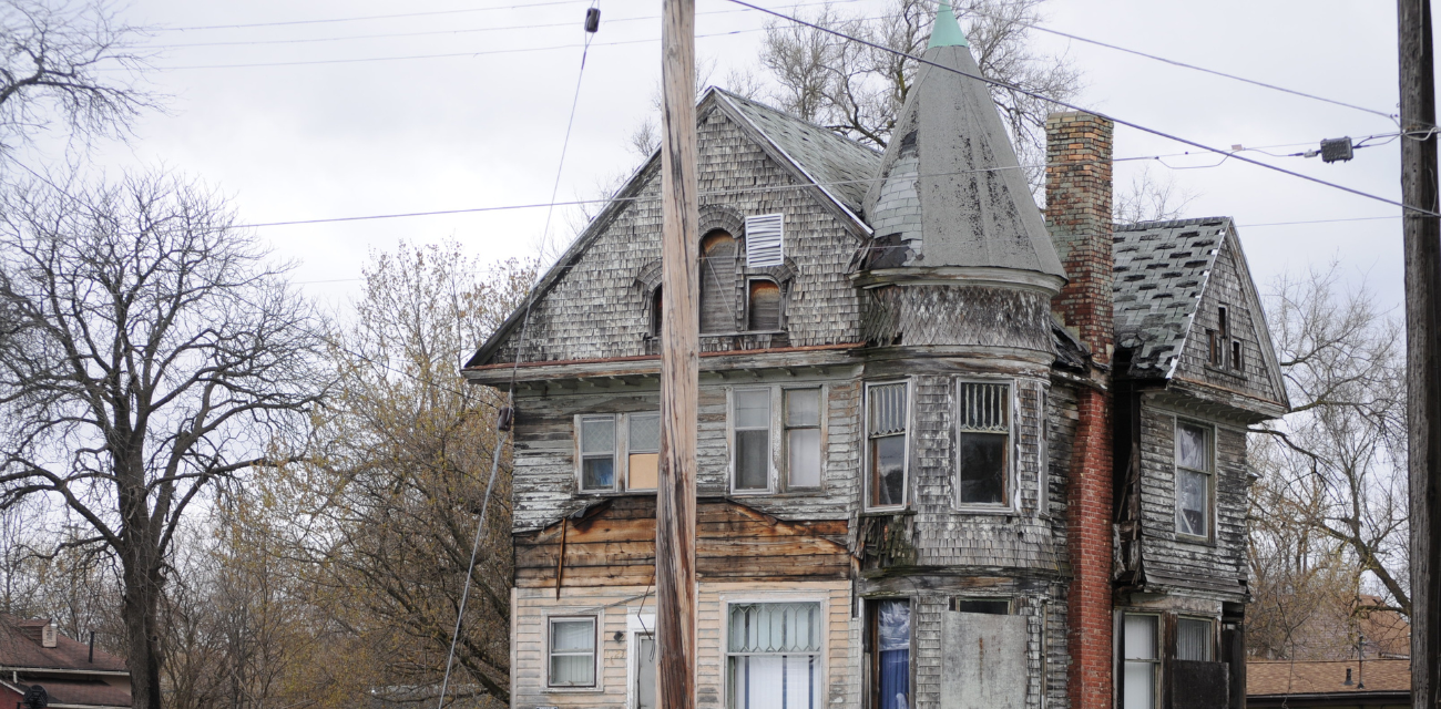 A blighted home remains upright in a Saginaw neighborhood