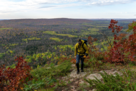 A man hikes through the Trap Hills of the western Upper Peninsula (Photo courtesy of Keep the UP Wild)