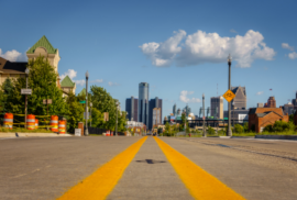 A road makes its way toward Downtown Detroit