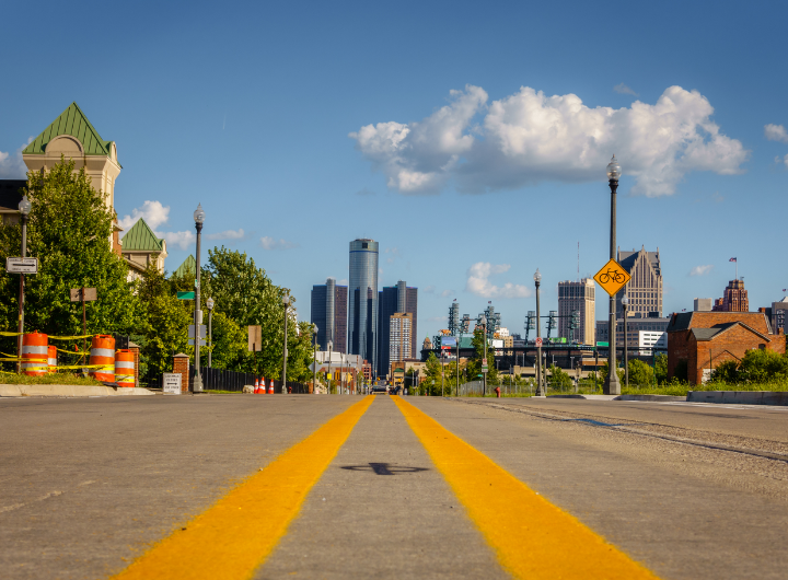 A road makes its way toward Downtown Detroit