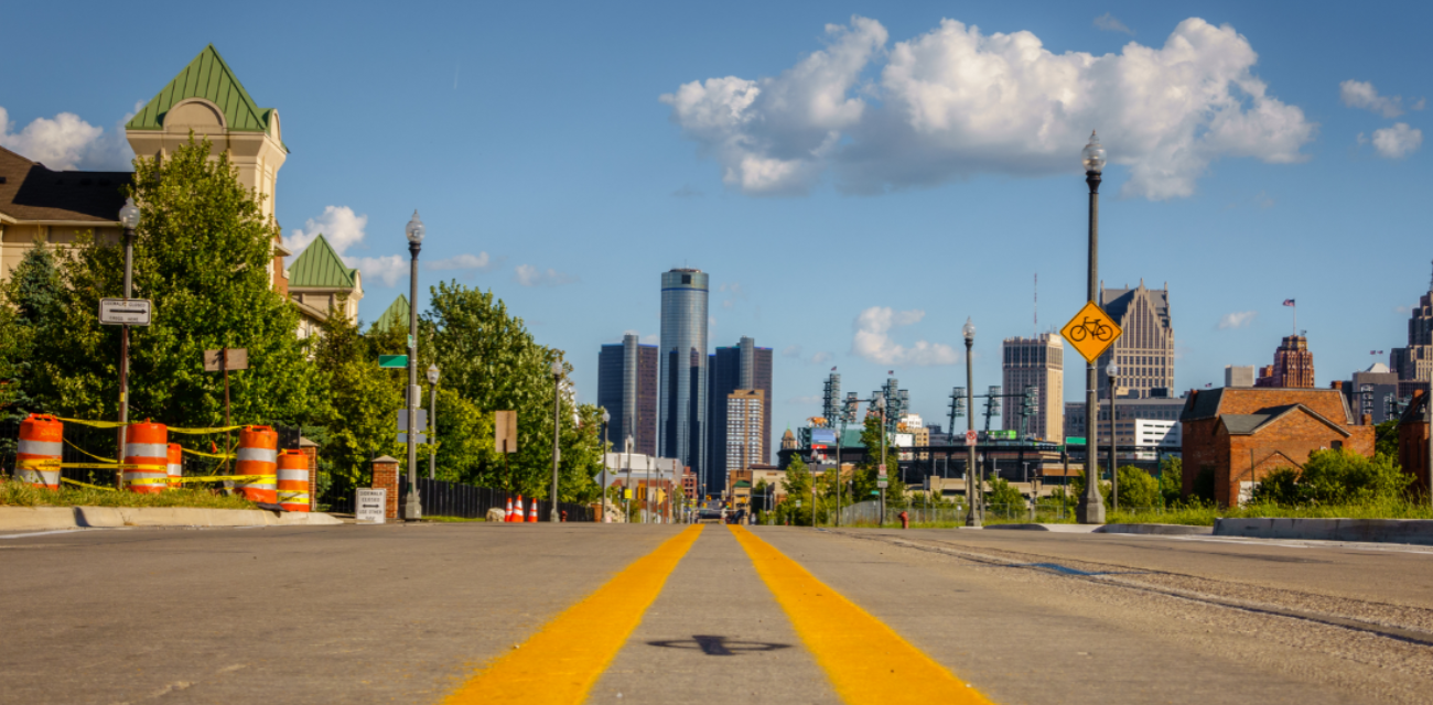 A road makes its way toward Downtown Detroit