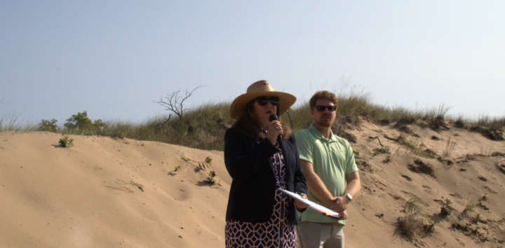 Reps. Rachel Hood and Joey Andrews discuss their dunes legislation at Oval Beach in Saugatuck (Photo by Nate Mathewson)