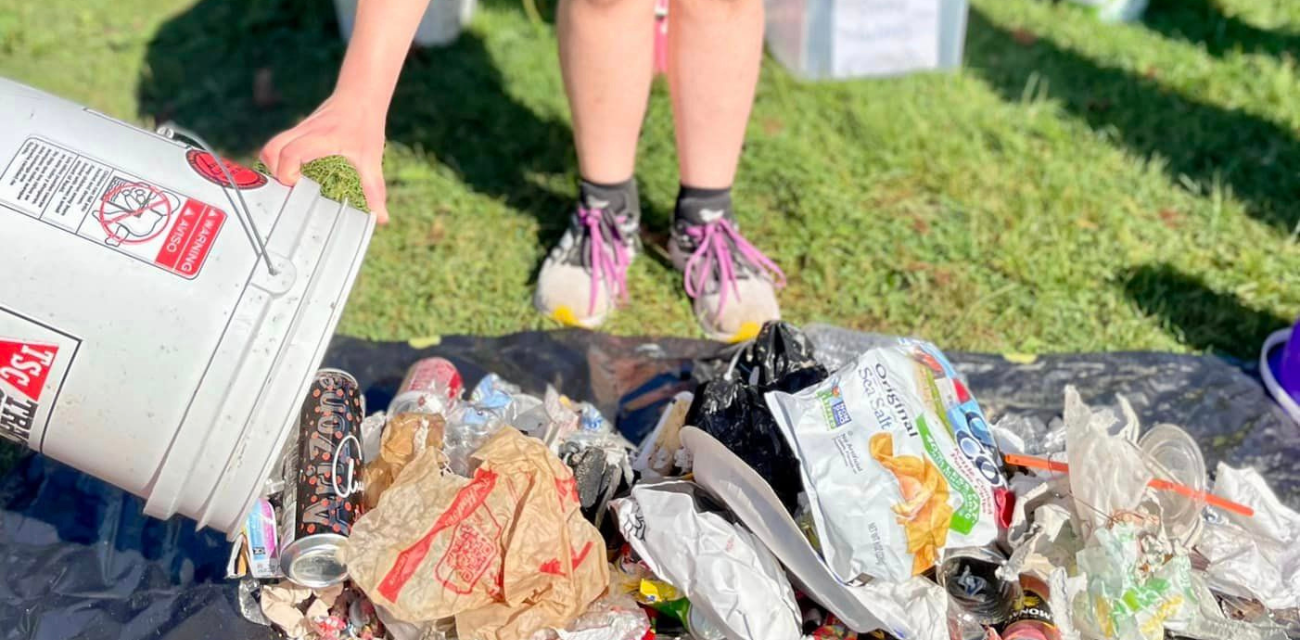 A volunteer dumps out trash collected at Lakeside Beach in Port Huron. (Photo courtesy of Friends of the St. Clair River)