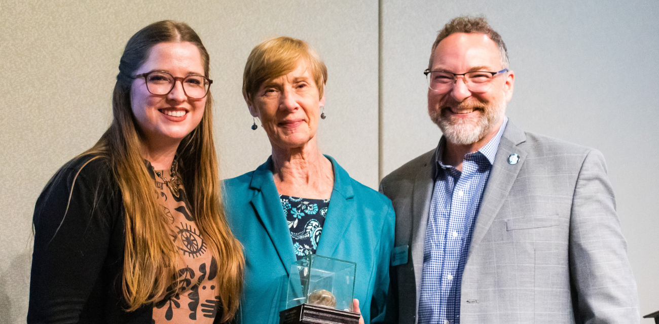 Susan LaCroix, Sandy Sorini Elser and Conan Smith pose after Sandy's Petoskey Prize award.