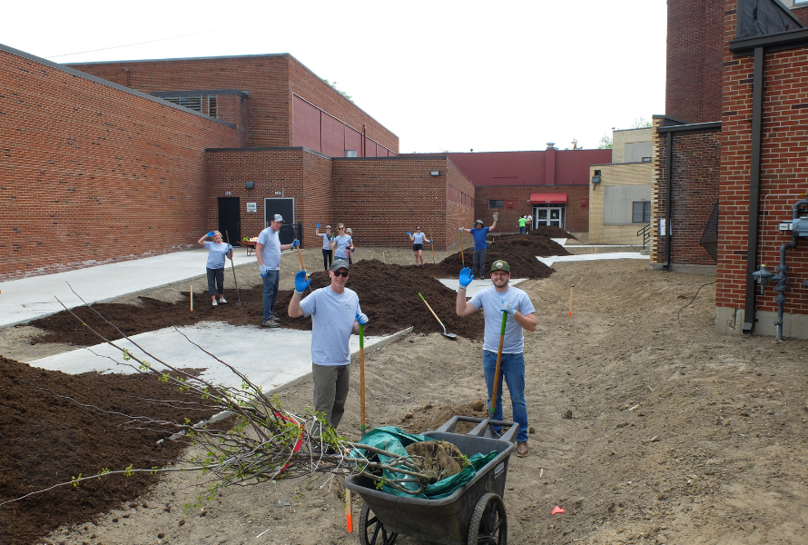 Friends of the Rouge volunteers pose for a photo as they work on a rain garden (Photo courtesy of Friends of the Rouge)