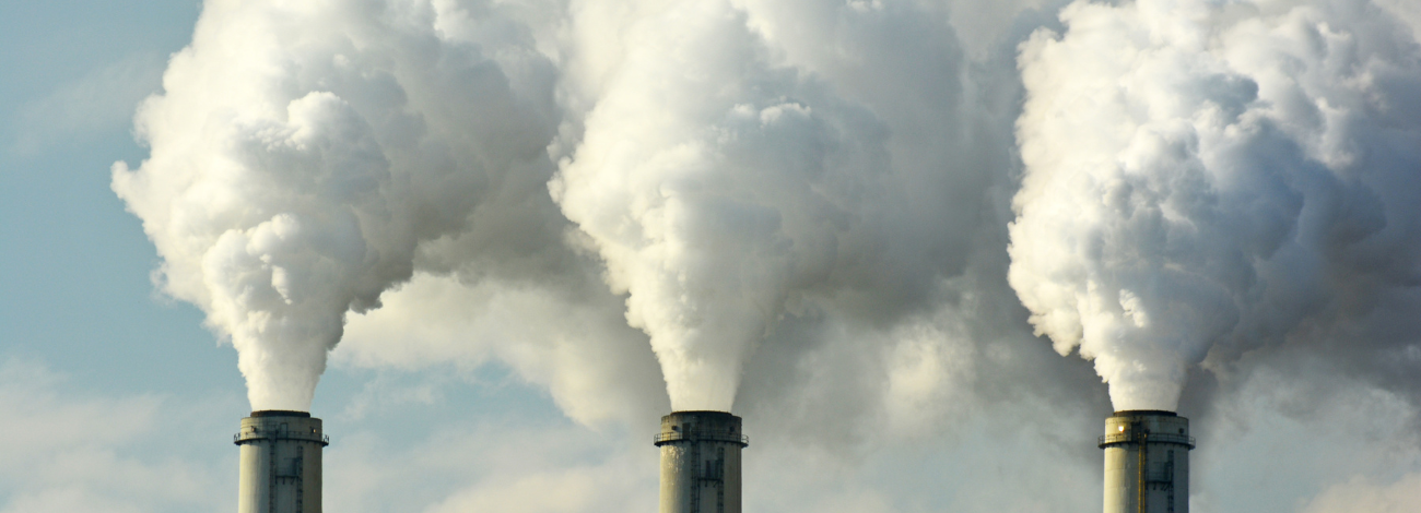 Coal plant smokestacks emit pollution