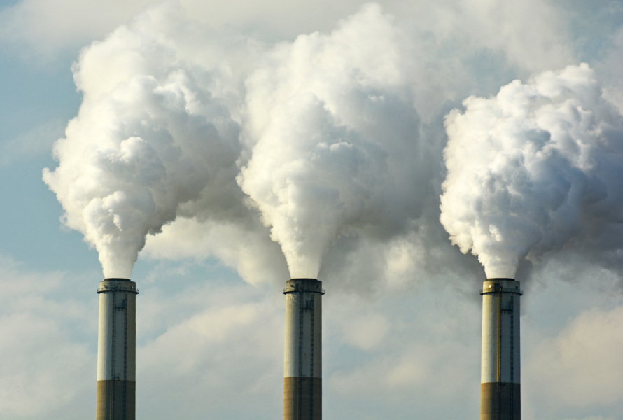 Coal plant smokestacks emit pollution