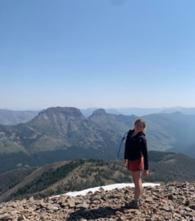 Lillian Putterbaugh poses for a photo atop a mountain. (Photo courtesy of Lillian Putterbaugh.)