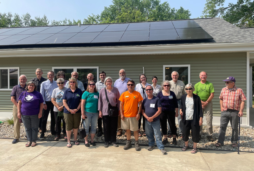 Members of Michigan Interfaith Power & Light Capital Area Chapter celebrate the construction and occupancy of a solar home. (Photo courtesy of Michigan Interfaith Power & Light)