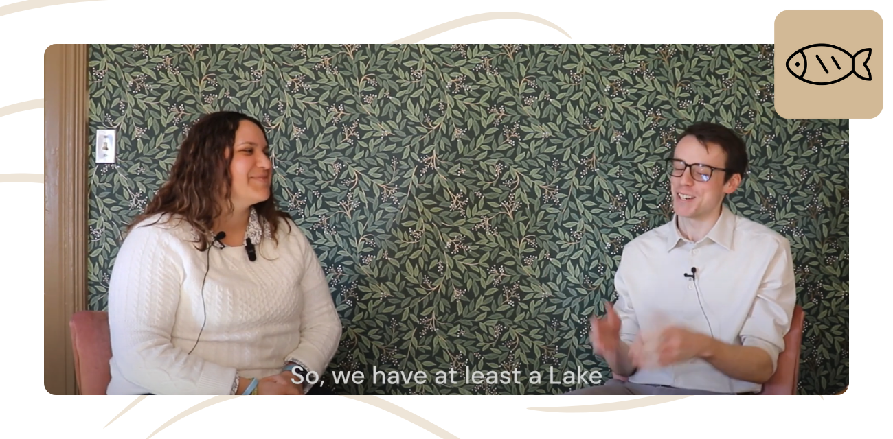 Emily Smith and Beau Brocket smile while talking about dunes for a podcast episode.