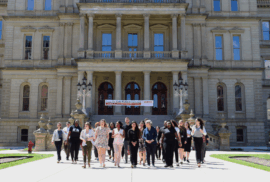 Members of Lead Education Day 2024 walk away from the Michigan Capitol.