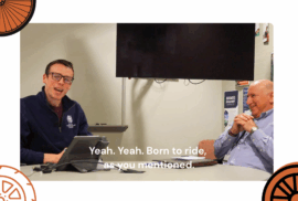 Beau Brockett, left, talks to the camera during a podcast recording while Eli Cooper smiles