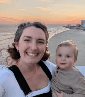 Meghann Carr poses for a photo with her son, Leo, on the beachside