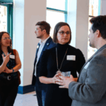 Members of the Environmental Council, center, talk to supporters during a 2024 Detroit policy soiree.