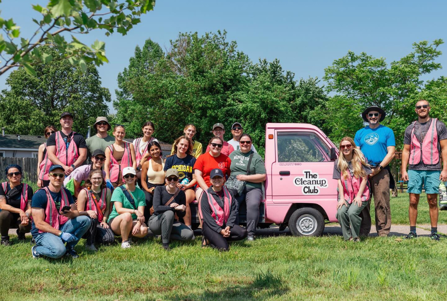 Volunteers with The Cleanup Club celebrate picking up over 2,000 pieces of trash in Ann Arbor. (Photo courtesy of The Cleanup Club)