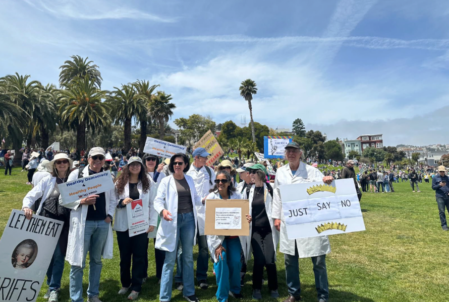 A group of Michigan physicians protest federal tariffs during a No Kings Day rally. (Photo courtesy of Michigan Clinicians for Climate Action)